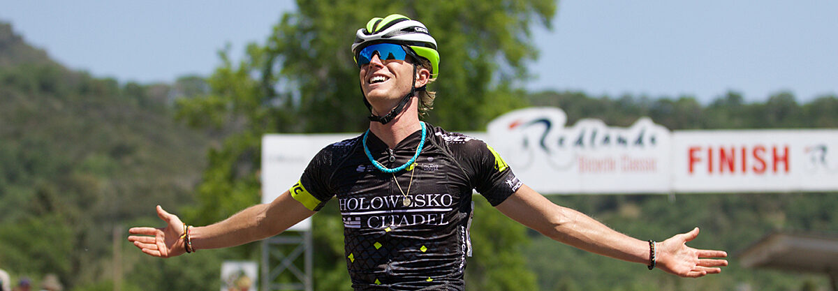 Cyclist celebrating across the finish line.