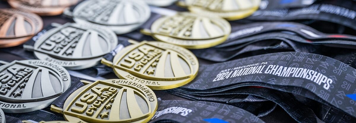2024 National Championship medals lying on a table.