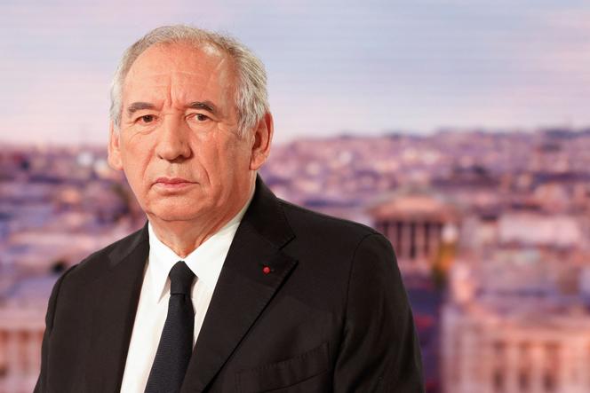 France's Prime Minister François Bayrou looks on as he poses ahead of an interview on the evening news broadcast of French TV channel TF1, in Boulogne-Billancourt, outside Paris, on August 27, 2025. 