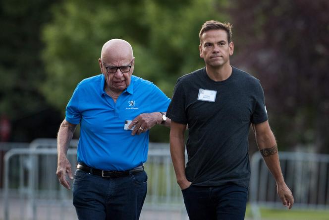 Rupert Murdoch, executive chairman of News Corp and chairman of Fox News, and Lachlan Murdoch, co-chairman of 21st Century Fox, walk together as they arrive on the third day of the annual Allen & Company Sun Valley Conference, July 13, 2017 in Sun Valley, Idaho.