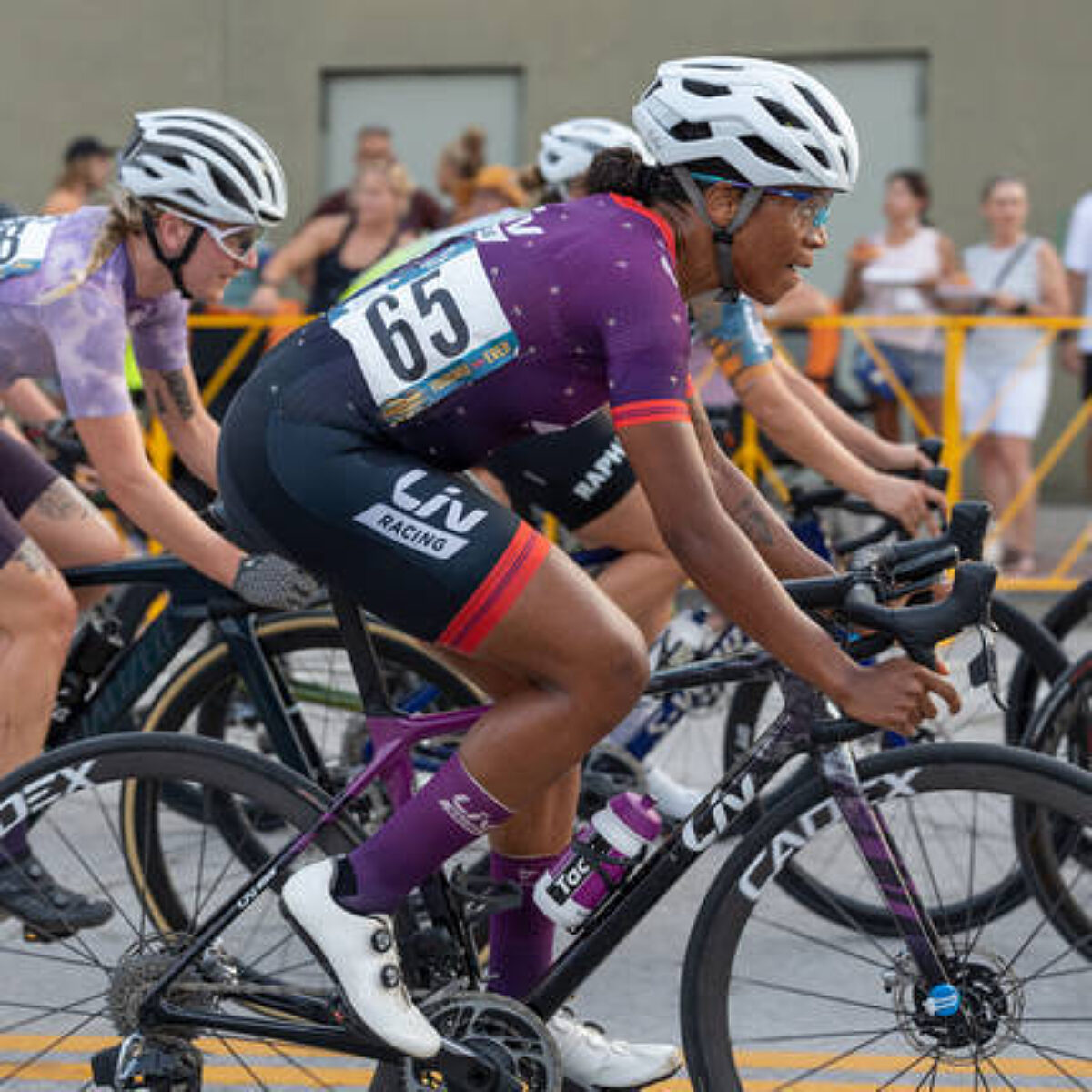Female road bike racer in a race