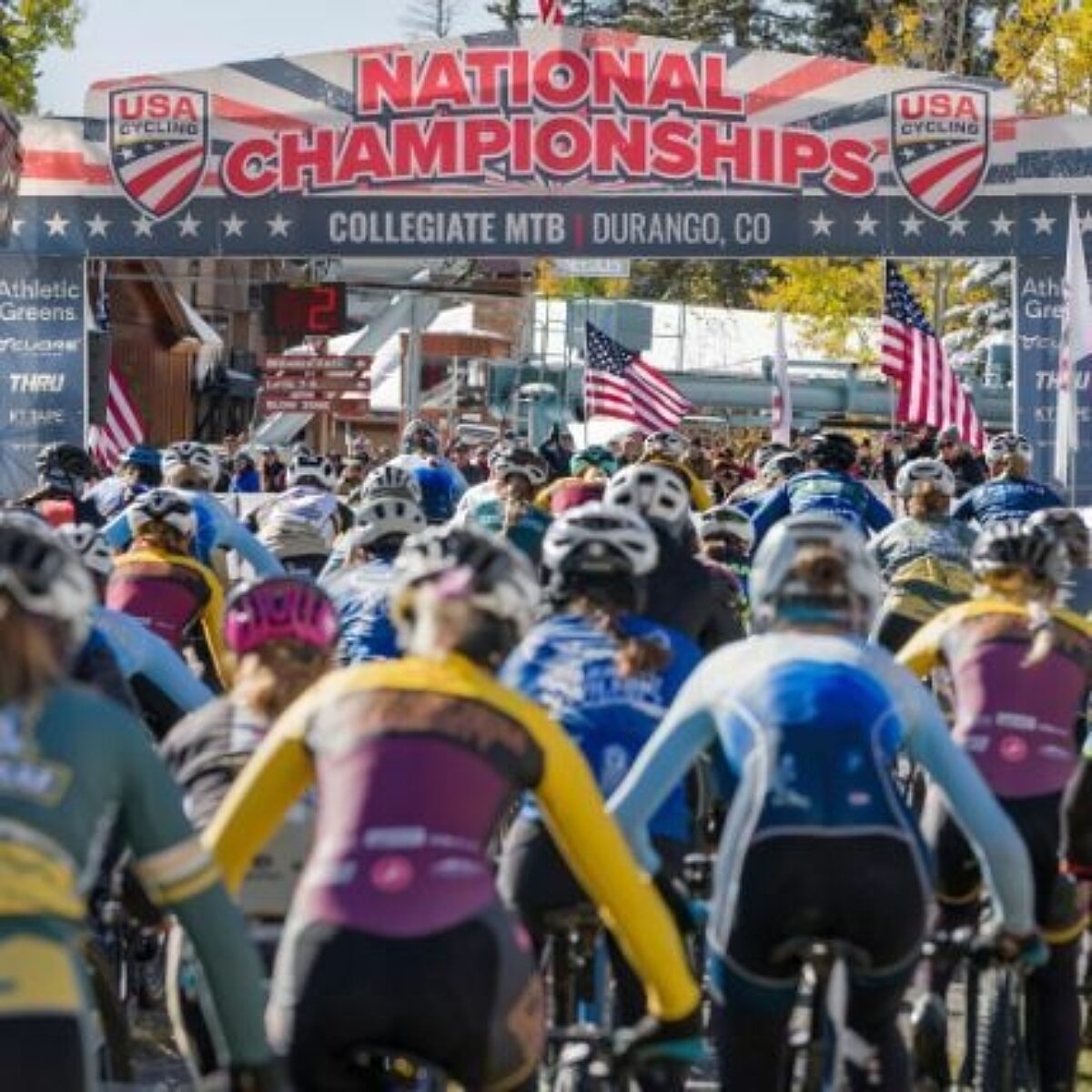 Large group of bike racers at the starting line of a race