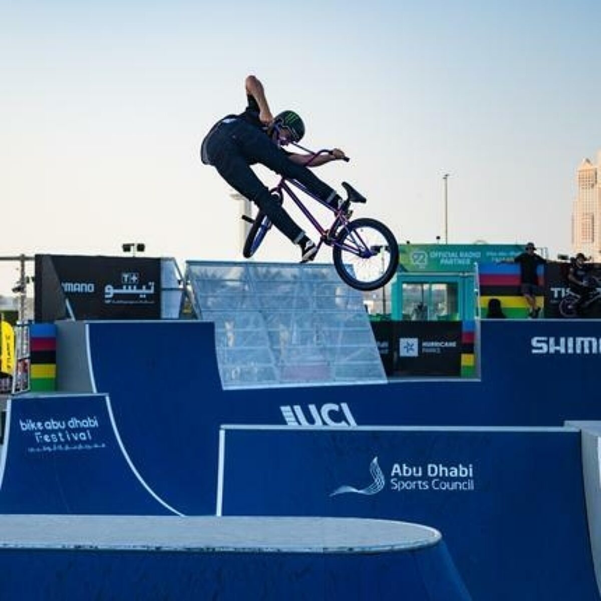 BMX Freestyle racer doing a trick mid-air.