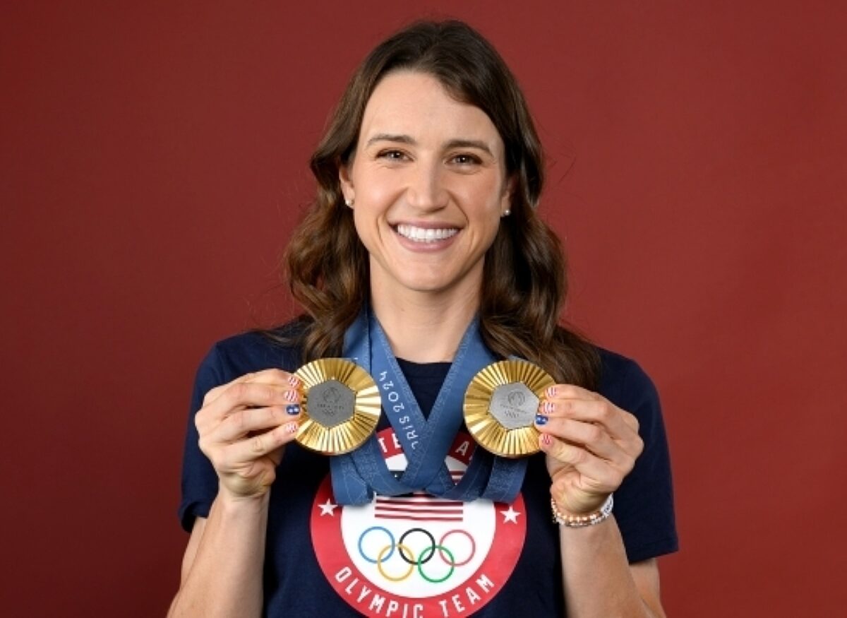 Kristen Faulkner holding two medals. Donate to USA Cycling | Support USA Cycling | USA Cycling Foundation. USA Cycling is a non-profit organization accepting tax-deductible donations.