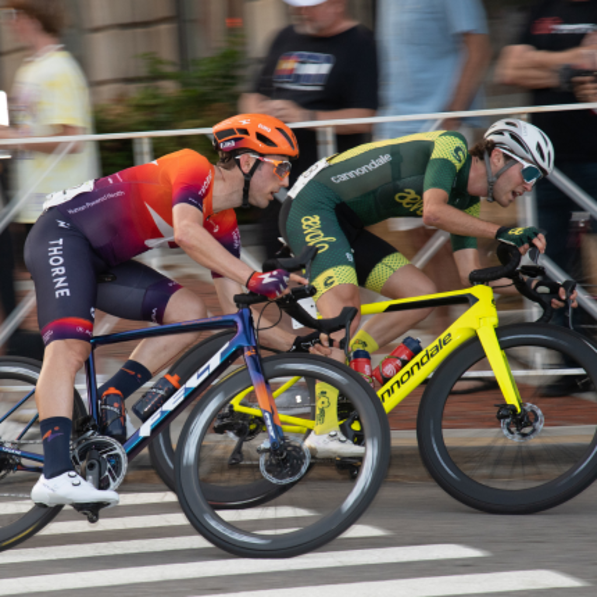 Two road bike racers going head to head in a criterium race
