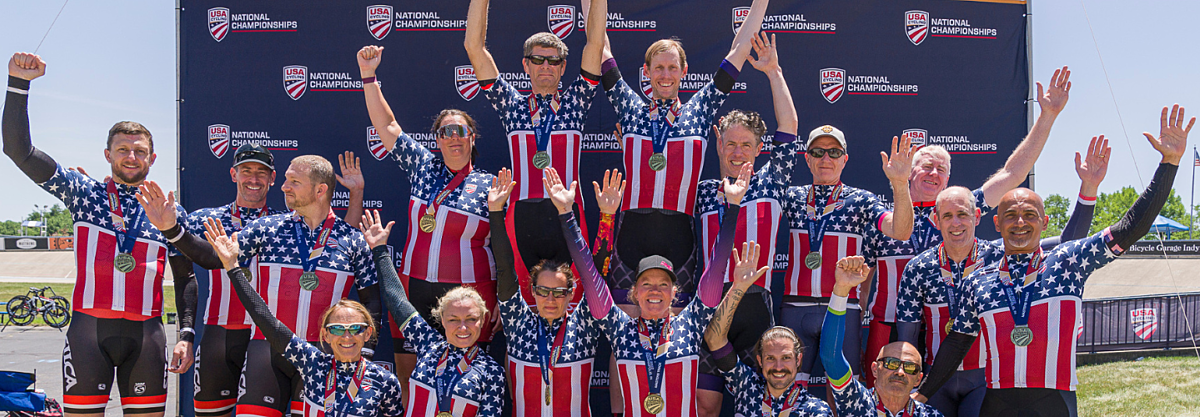Group of cyclists celebrating on the podium.